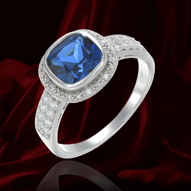 Sparkling Blue Sapphire Bezel Set Ring